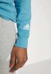 Damska bluza z bawełny Adidas Essentials Linear za 115zł (rozm.XS-XL) @ Lounge by Zalando